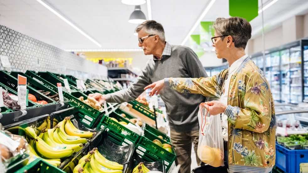 Senior couple grocery shopping